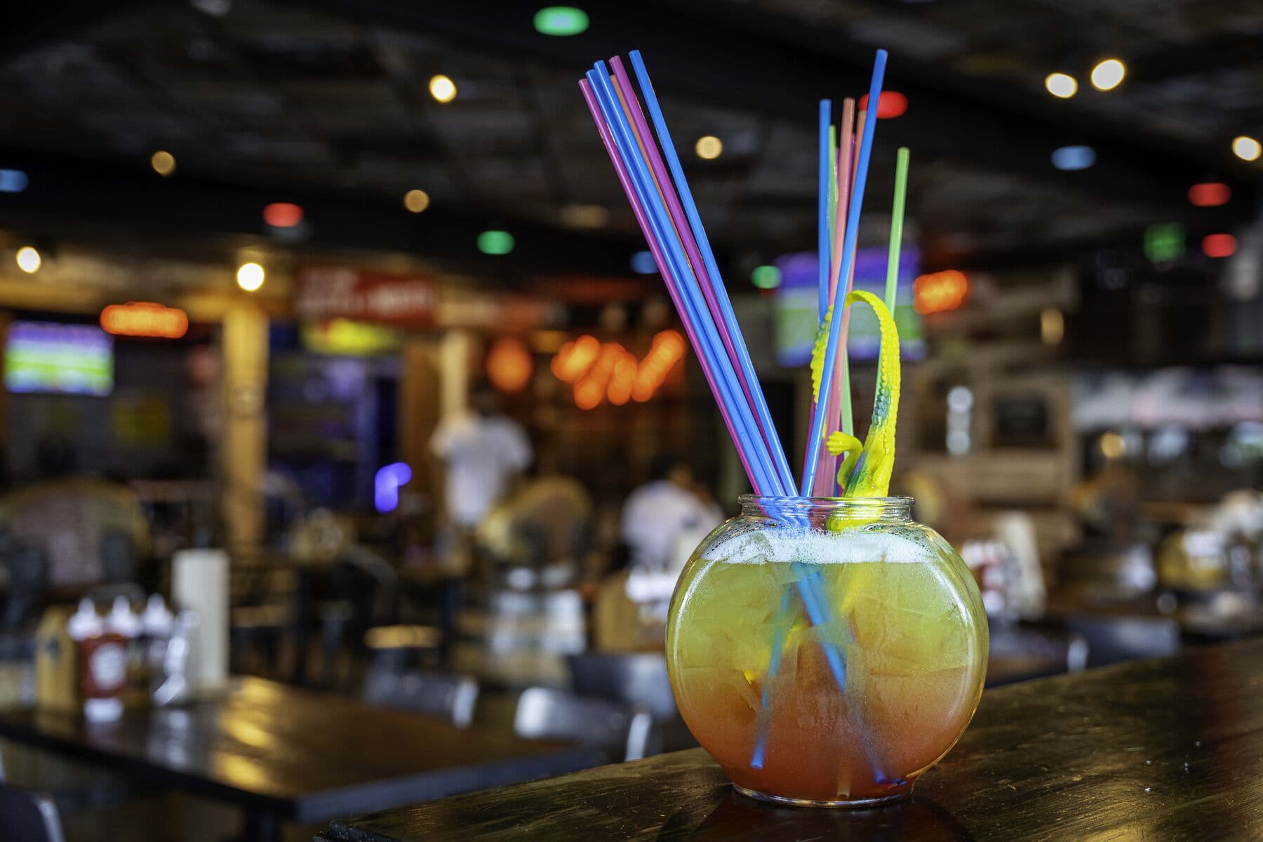 Swamp Water cocktail served in a fishbowl at the bar